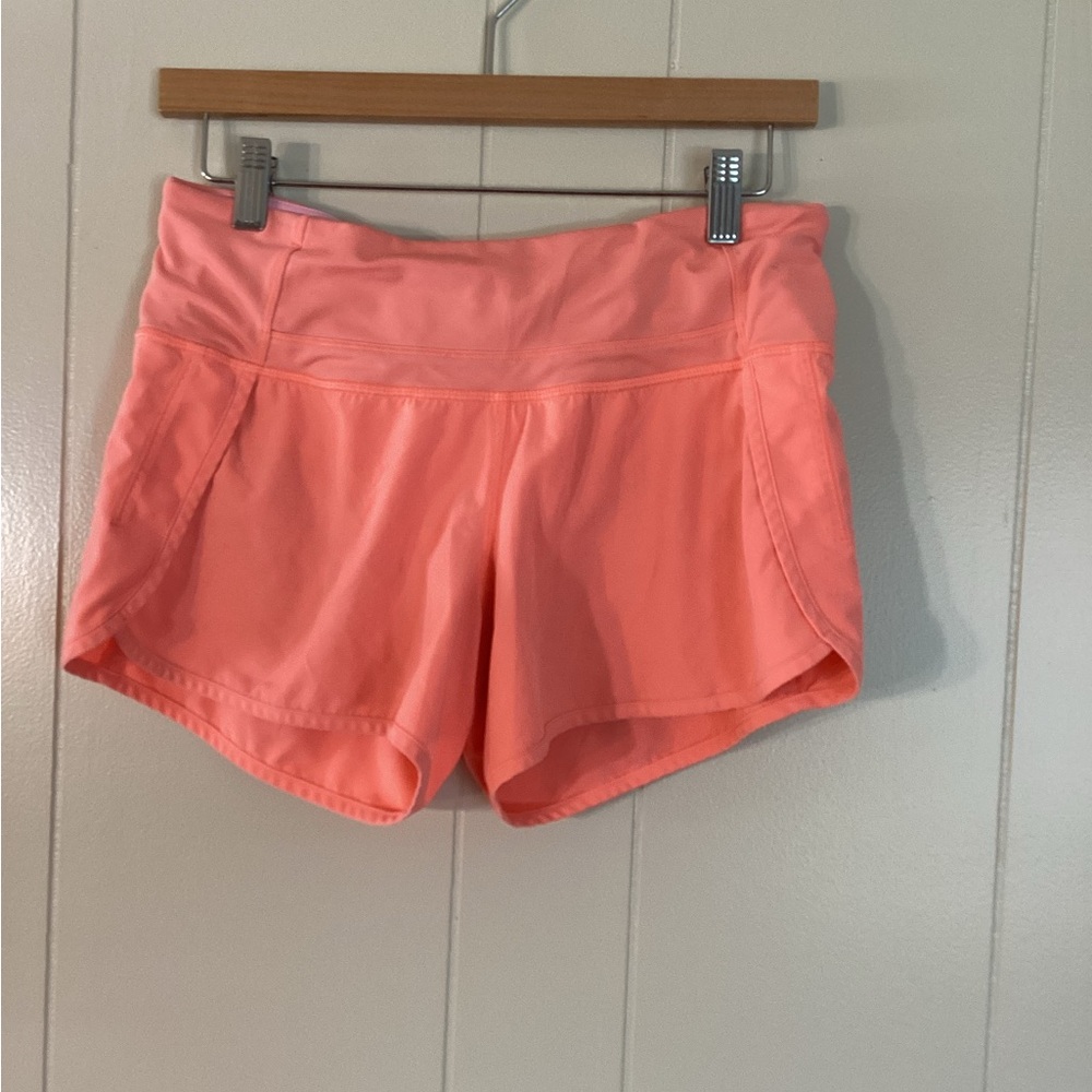 Lululemon Running shorts size 4 neon orange with pink lining